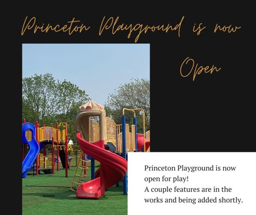 Photo of the colorful Princeton Playground showing bright red, blue, and yellow slides and climbing structures on a green turf surface. Trees with green leaves are in the background. Overlaid text reads 'Princeton Playground is now Open' with a note that some features are still being added.