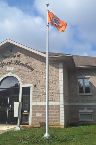 The orange 'Every Child Matters' Flag flowing at the Township Administration Office.